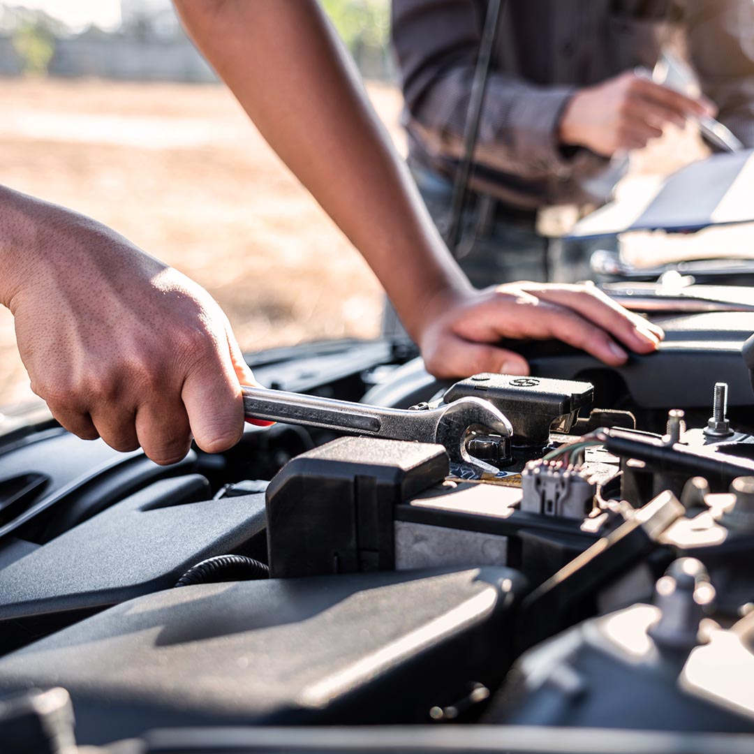 men working on an engine