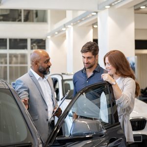 couple looking at a vehicle